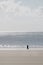 Person Walking along Beach