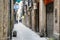 Person walking down a lane in the Gothic Quarter of Barcelona