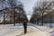 Person walking down snowy pathway in Munich