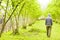 Person walking near hazelnut trees plantations in Georgia