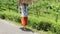 Person walks holding large wood pile over head slow