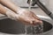 person washing hands sink. High quality photo