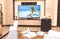 A person is watching TV. A sick person at home in quarantine dreams of traveling and looks at the sea and the beach on TV, next to