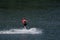 Person water-skiing on a lake in Niedersfeld, Germany