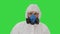 Person wearing a hazmat suit and mask walking on a Green Screen, Chroma Key.