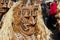 Person wears a carnival costume and mask at Lucern Carnival in Lucerne, Switzerland.