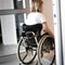 Person in a wheelchair entering an elevator