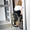 Person in a wheelchair entering an elevator
