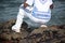 A person who is a fan of candomble on the beachfront paying homage to iemanja on Rio Vermelho beach in Salvador, Bahia