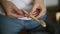 Person woman hand demonstrating wooden bamboo toothbrush iroi. showing oral hygiene product.