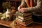 a person wrapping twine around a stack of old books