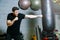 Personal boxing trainer. guy trains with boxing pear.