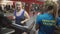 Personal fitness trainer motivating overweight girl during workout, high five