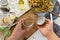 Personal perspective of woman hands preparing Amanita caesarea mushroom