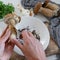 Personal perspective of woman hands preparing mushrooms Boletus edible for cooking them