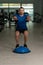 Personal Trainer Doing Exercise On Bosu Balance Ball