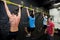 Personal Trainer giving fitness instruction at a Crossfit group class