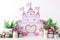 Personalized romantic castle decor with colorful spring flower pots, for the first birthday