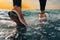 A persons feet running by the ocean , concept of Motion, created with Generative AI technology