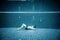 Persons lies under water in a swimming pool