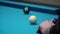 Persons play in snooker game, man plays in billiard