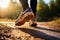 A persons running shoe in natural splendor, touched by sunlight