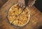 Persons take pieces of baked homemade cheese pie on wooden background. Bulgarian banitsa, Georgian khachapuri,