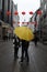 PERSONS WALK UNDER EMBRELLA IN RAINY WEATHER