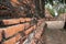 Perspective angle of brick wall and location in the ruins of ancient remains at Wat Worachet temple.