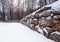 Perspective of beautiful old stone wall, with a misty winter forest in the background.