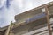 Perspective bottom shot of reinforced constructed housing structure with over cast sky in Izmir at Turkey