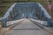 Perspective center angle view at the bridge in metallic truss structure over Douro River in Pinhao city, asphalt road