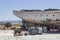 Perspective close shot of back side fishing boat on ground for painting of trunk at Lesvos, Kalloni