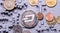 Perspective crypto-currencies: coins on a printed circuit board of gray color.