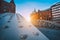 Perspective of iron arch bridges in historical warehouses in Speicherstad district in Hamburg, Germany. Backlit sun