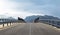 Perspective of road bridge against mountains