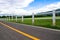 Perspective road and white White fence farm and sky