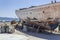 Perspective shot of back side fishing boat on ground for painting of trunk at Lesvos, Kalloni