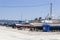 Perspective shot of back side fishing boats on ground for painting of trunk at Lesvos, Kalloni