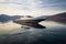 perspective shot of a long, sleek speedboat on a lake