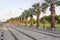 Perspective shot of tramway line with pedestrian stones at sunse