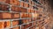 Perspective, side view of old red brick wall texture background