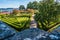 Perspective in sunny day of gardens in Ajuda botanical garden, Lisbon PORTUGAL