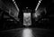 Perspective view in church. A few people sit on wooden bench with many of empty bench in church on Sunday. Black and white scene