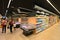 Perspective view of almost deserted supermarket shelves rows