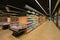 Perspective view of almost deserted supermarket shelves rows