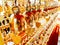 Perspective view group of small golden bells hang in Thai temple