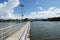 Perspective view of jetty with LED street light with solar cell on clear blue sky.