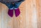 Perspective view of a kid`s feet with purple socks and blue jean