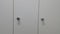 Perspective view of lockers or cupboards in a row with white doors